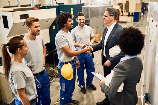 Engineering team collaborating in an industrial facility